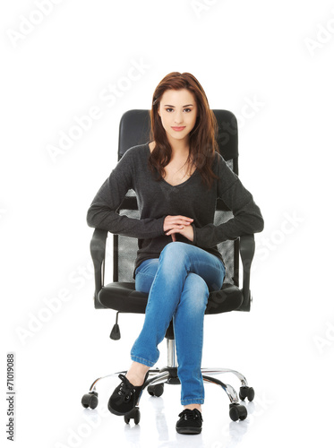 Young happy student woman sitting on a wheel chair
