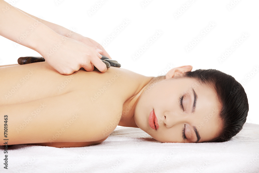 Girl on a stone therapy, hot stone massage Girl on a stone therapy, hot stone massage