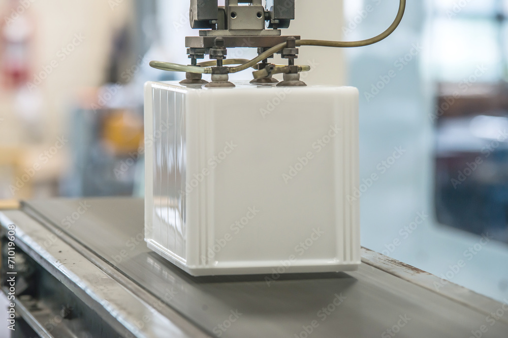 Naklejka premium Industrial robot working in factory