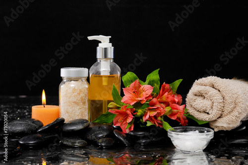 Spa Still life with red flower, massage oil