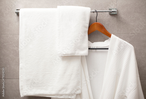 towel and robe on the rack in the bathroom