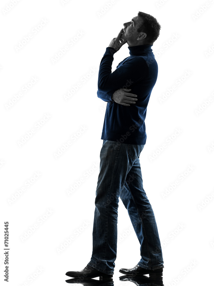 Naklejka premium man looking up pensive silhouette full length