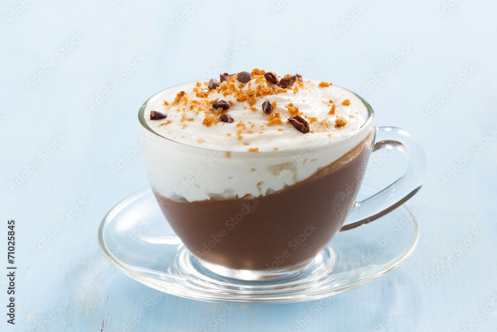 chocolate dessert with cream and amaretti on a blue background chocolate dessert with cream and amaretti on a blue background