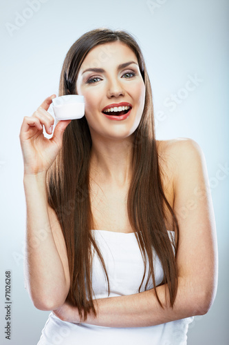 Smiling model portrait with cream. Skin care model posing.