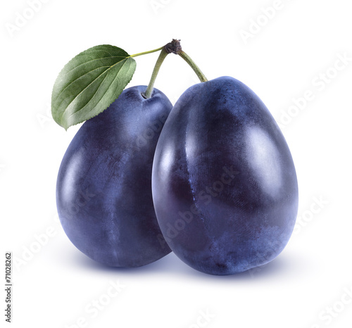 Whole blue plums isolated on white background