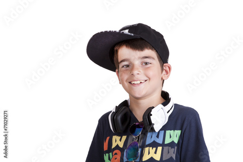 child with current clothing with headphones listening to music