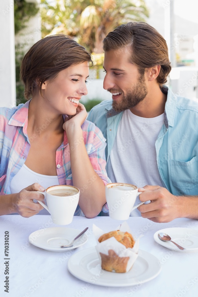 Happy couple enjoying coffee together Happy couple enjoying coffee together