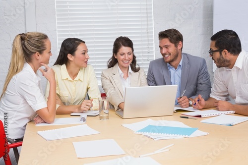Casual business team having a meeting using laptop © WavebreakmediaMicro
