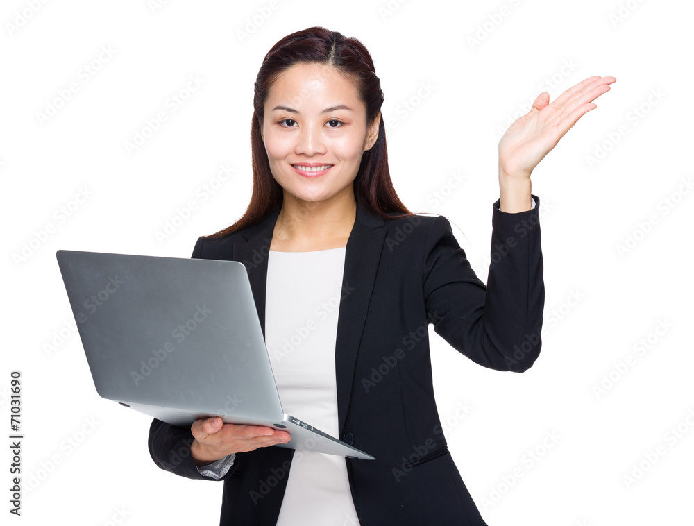 Businesswoman use laptop and hand show something Businesswoman use laptop and hand show something