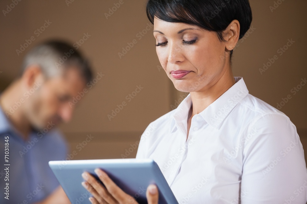 Female manager using digital tablet in warehouse Female manager using digital tablet in warehouse