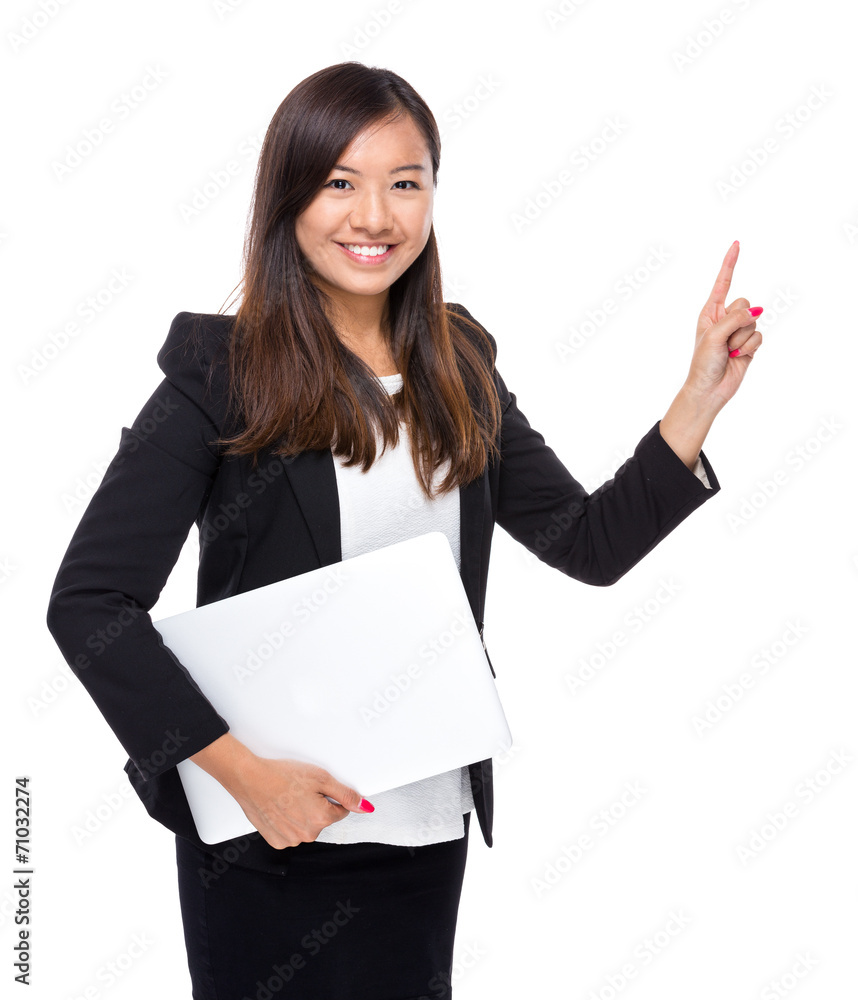 Businesswoman with laptop computer and finger point up Businesswoman with laptop computer and finger point up