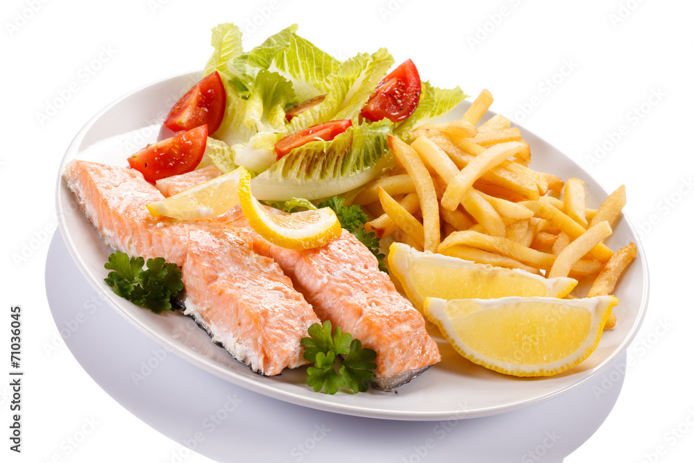 Grilled salmon and vegetables on white background Grilled salmon and vegetables on white background