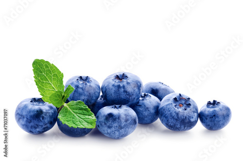 Fresh blueberry with green leafs of mint on white background