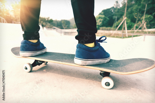 skateboarding legs on skatepark