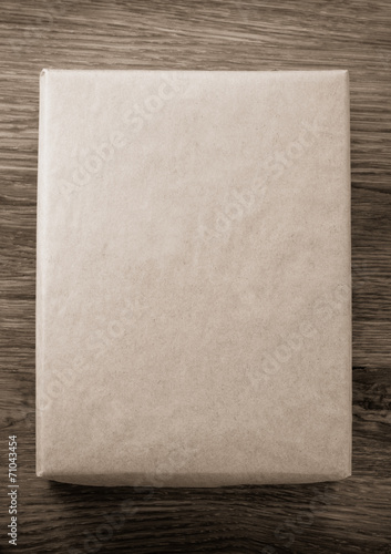 Фотография parcel wrapped packaged box on wood