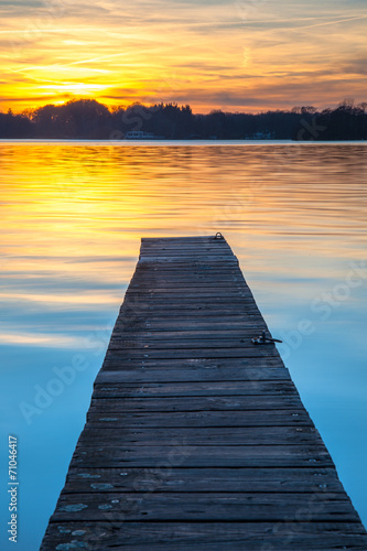 Beautiful Sunset over Wooden Jetty in Groningen, Netherlands