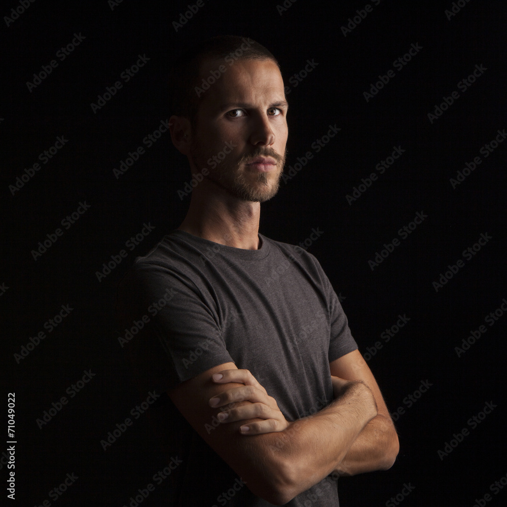 portrait of a handsome young man on black background portrait of a handsome young man on black background