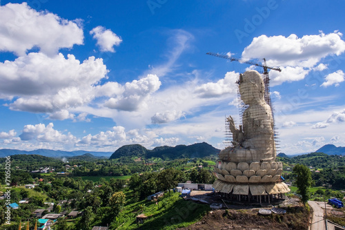 Chinese angel architecture in Thai temple under cloudy blue sky