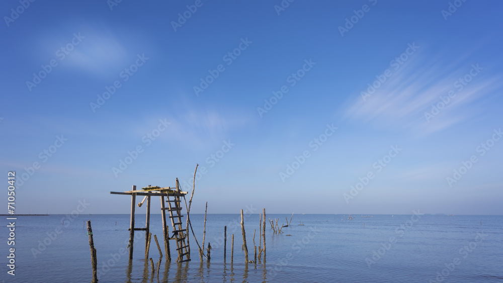 Old and abandon wooden platform at calm sea