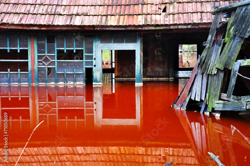 A house flooded by industrial mining water