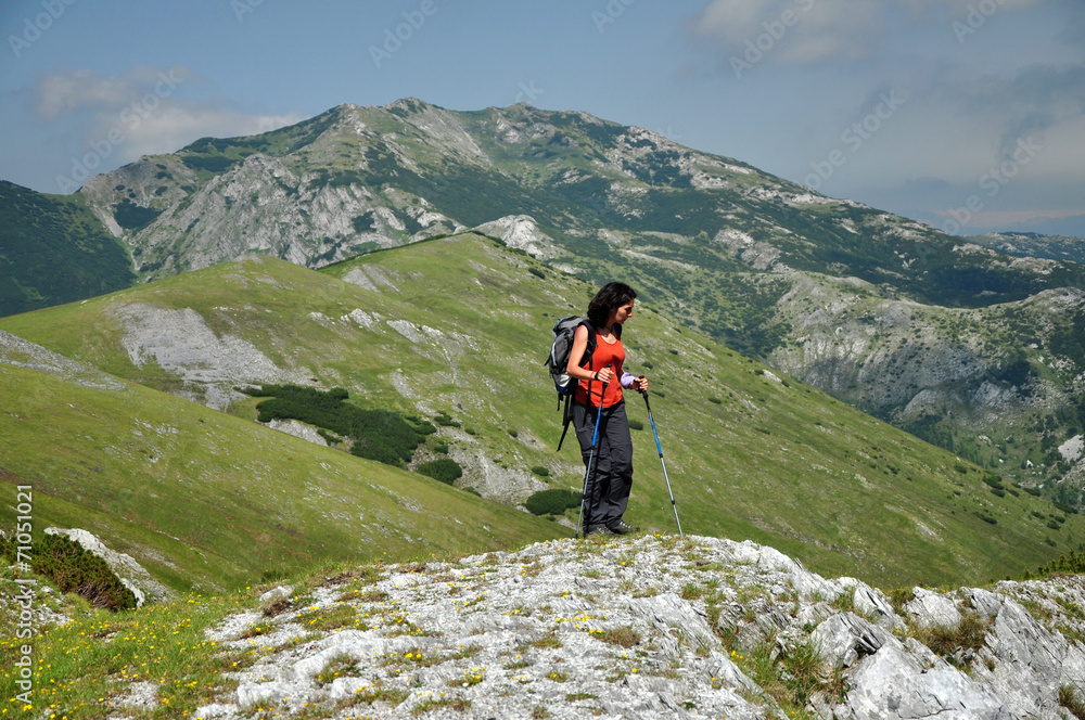 Trekking girl in the mountains