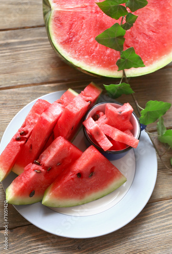 Fresh slices of watermelon on wooden table  close up