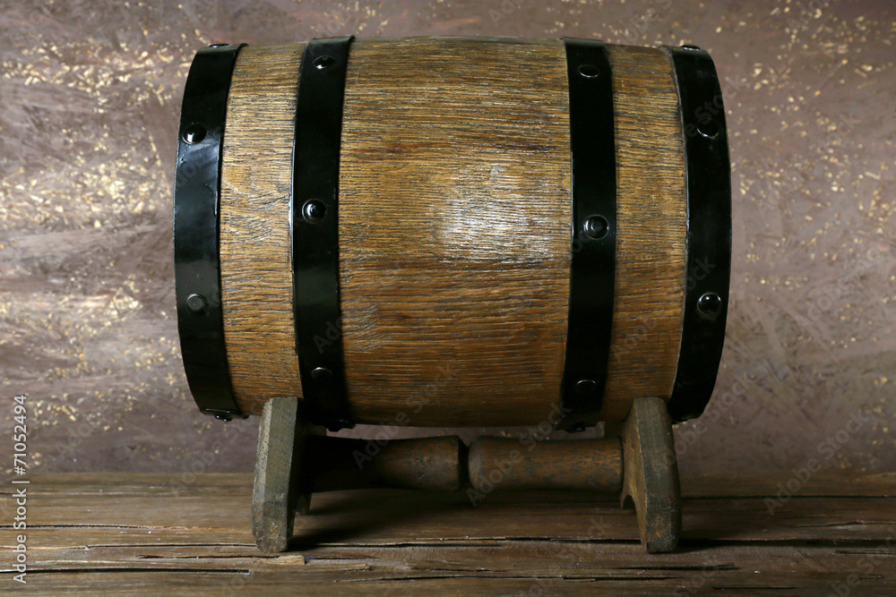 Barrel on wooden table on wooden wall background Barrel on wooden table on wooden wall background