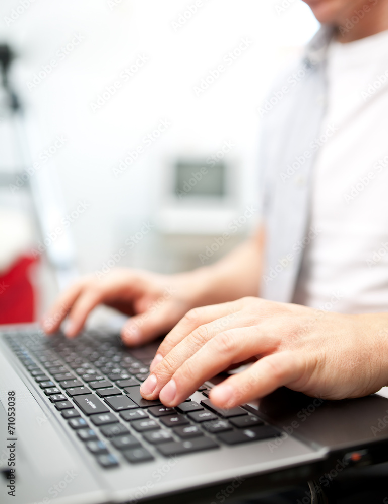 Man working on the laptop at home Man working on the laptop at home