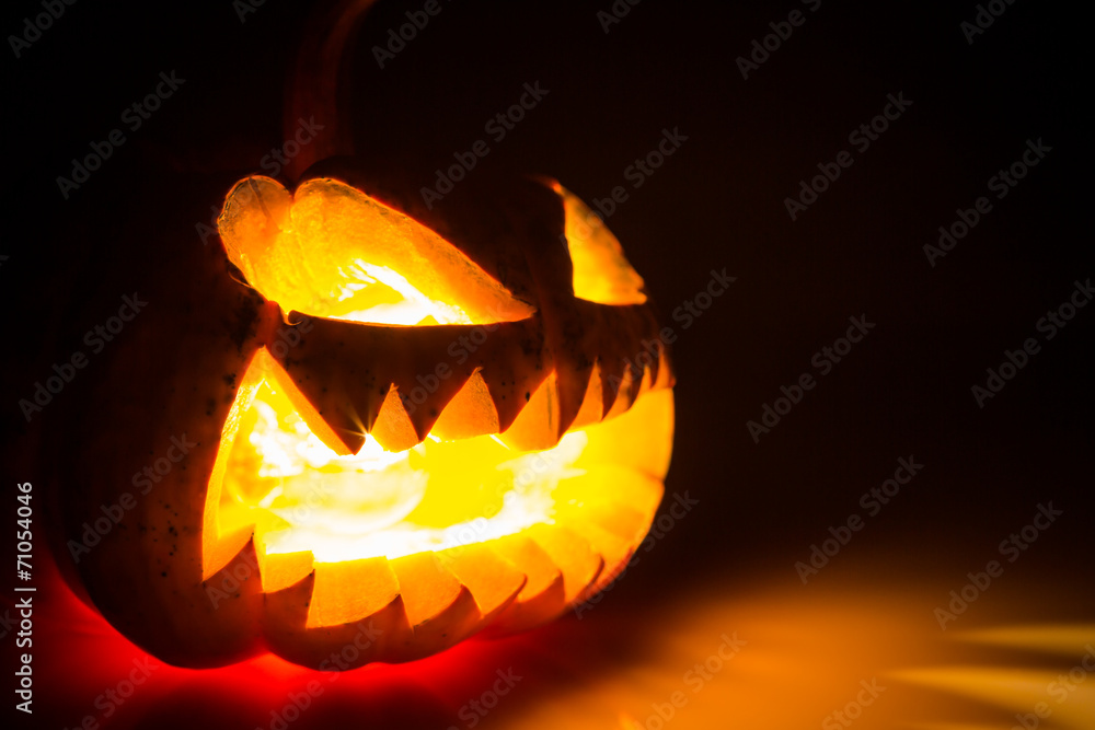 Halloween scary face pumpkin on black background Halloween scary face pumpkin on black background