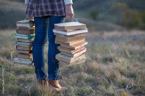 Girls hands holding books