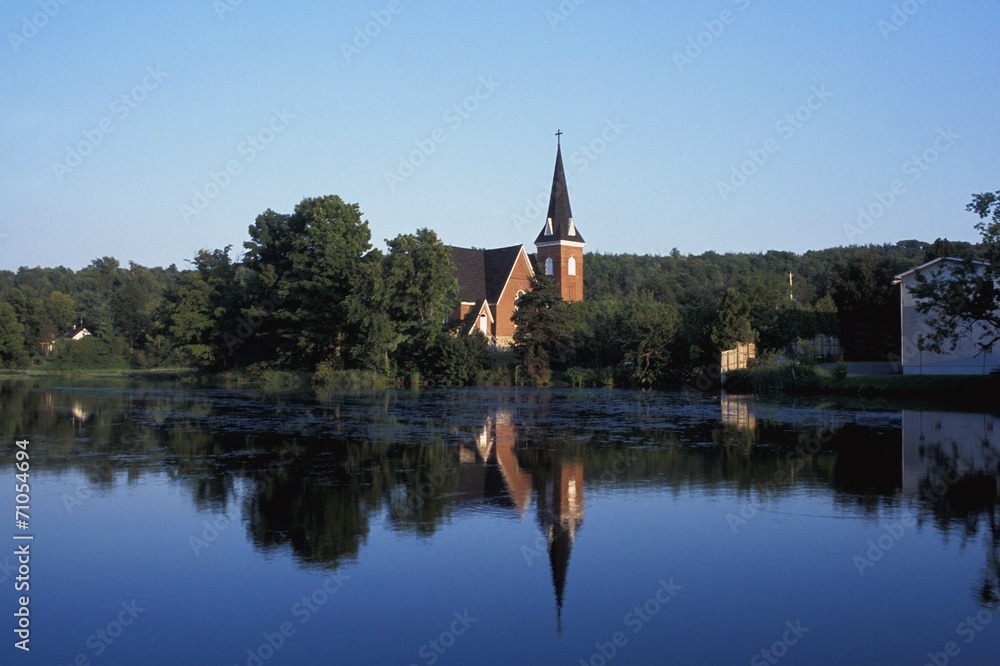 Countryside And Church Reflected In The Lake