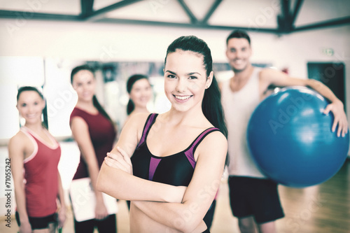 woman standing in front of the group in gym