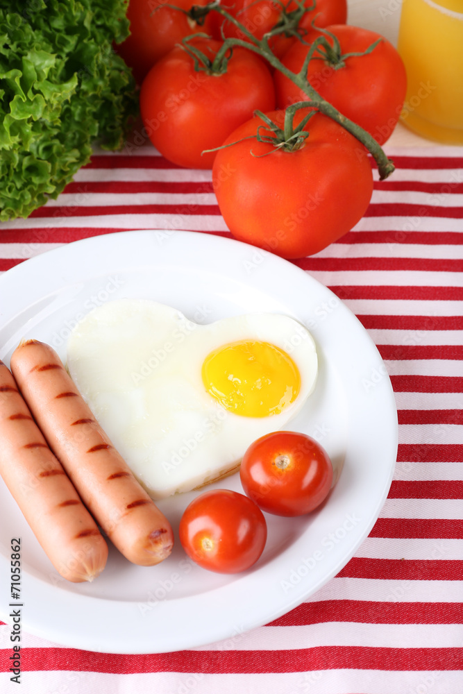 Scrambled eggs with sausage and vegetables served Scrambled eggs with sausage and vegetables served