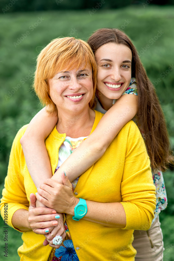 Portrait of mother with her daughter in the park