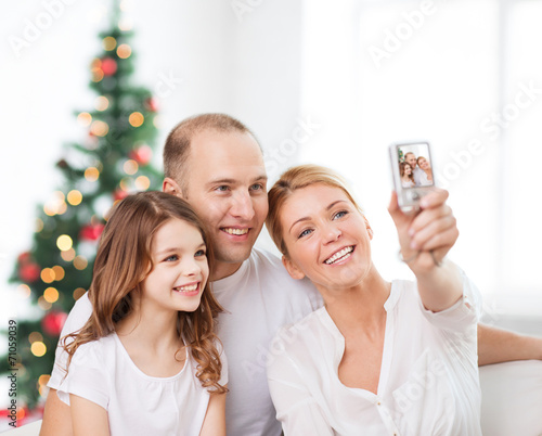 happy family with camera at home