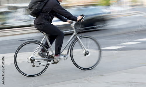 Man on silver colored bike © Pink Badger