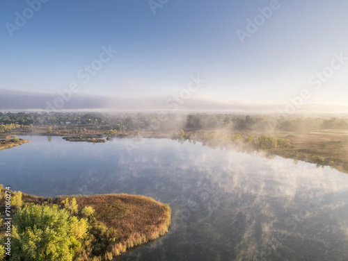 aerial view of a foggy lake