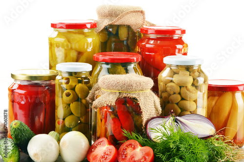 Composition with jars of pickled vegetables. Marinated food