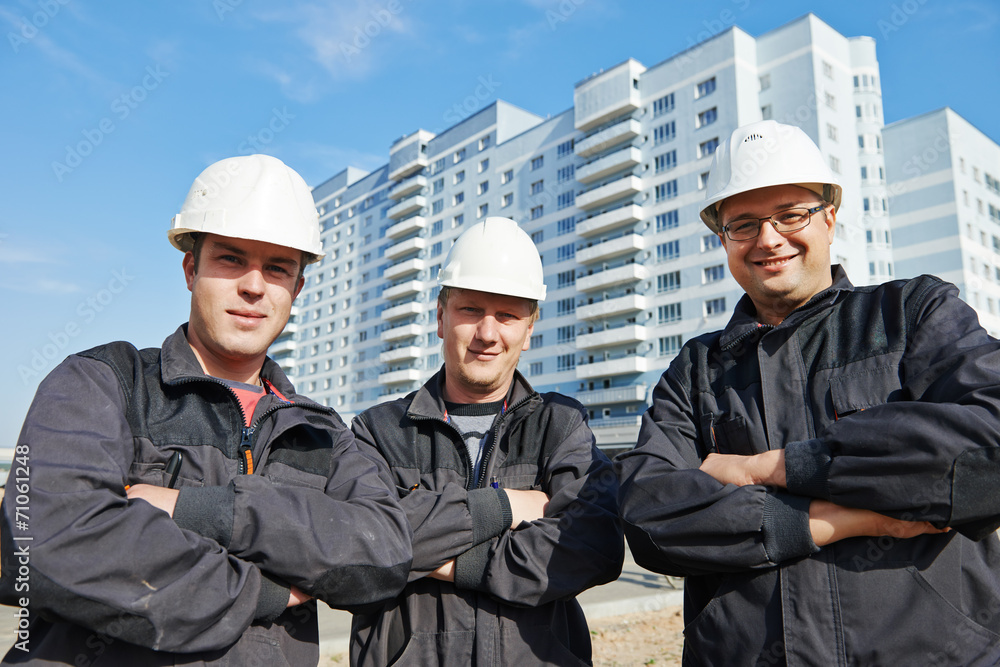 Builders team at construction site Builders team at construction site