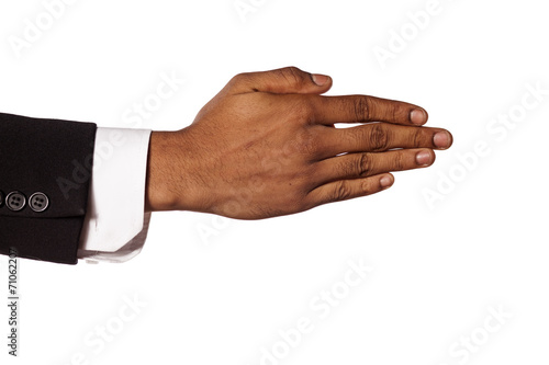 dark skinned hand in suit with fingers collected