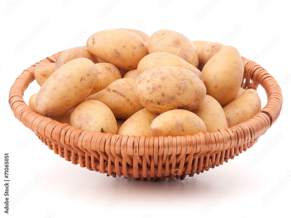 Potato tuber in wicker basket isolated on white background Potato tuber in wicker basket isolated on white background