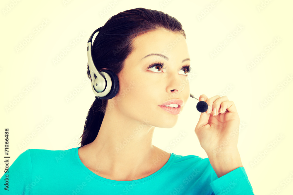 Beautiful young call-center assistant smiling Beautiful young call-center assistant smiling
