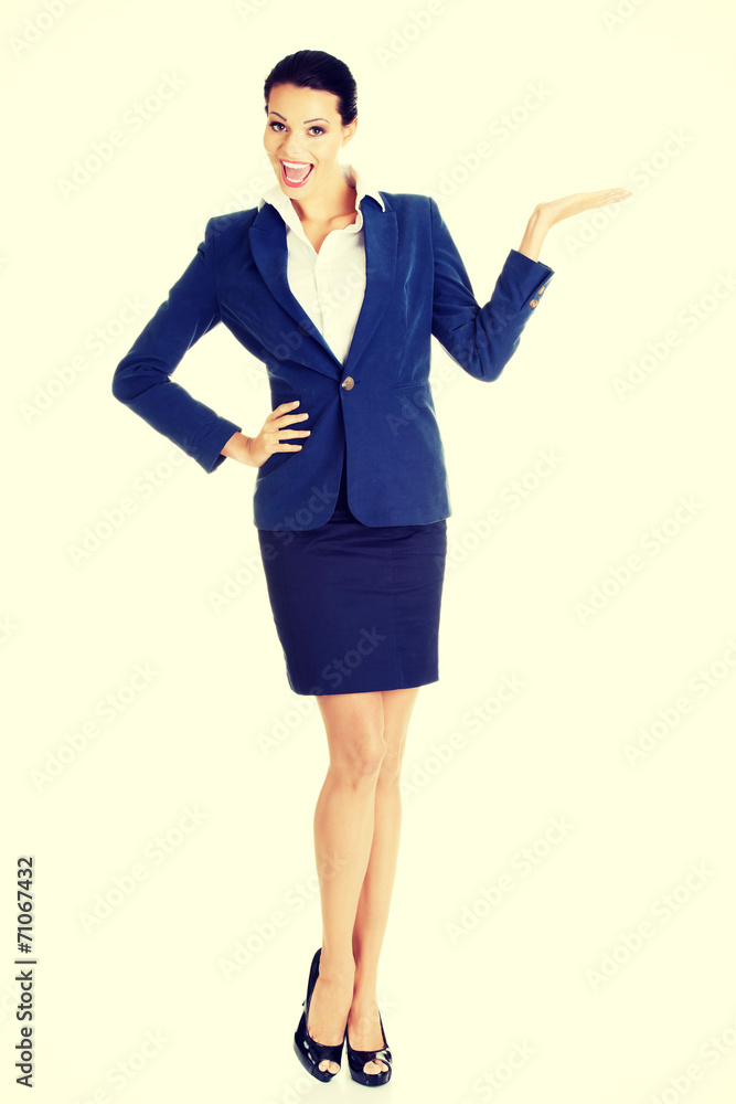 Happy young business woman showing copy space Happy young business woman showing copy space