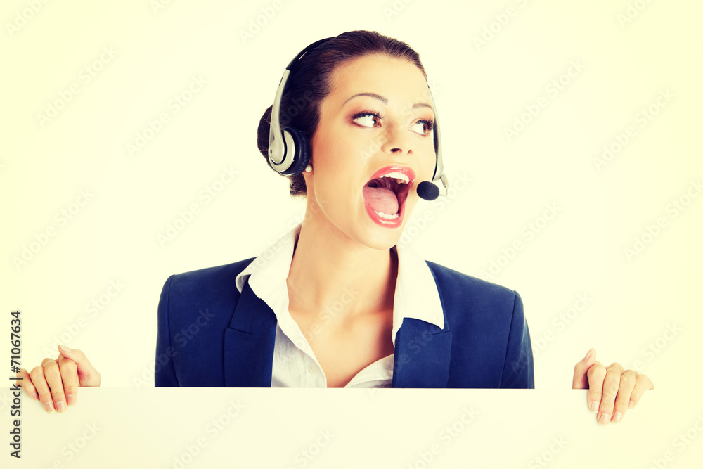 Call center worker holding blank board Call center worker holding blank board