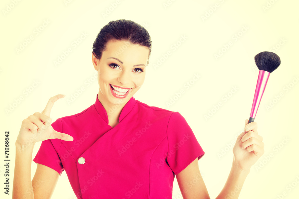Young make-up artist woman showing copy space Young make-up artist woman showing copy space