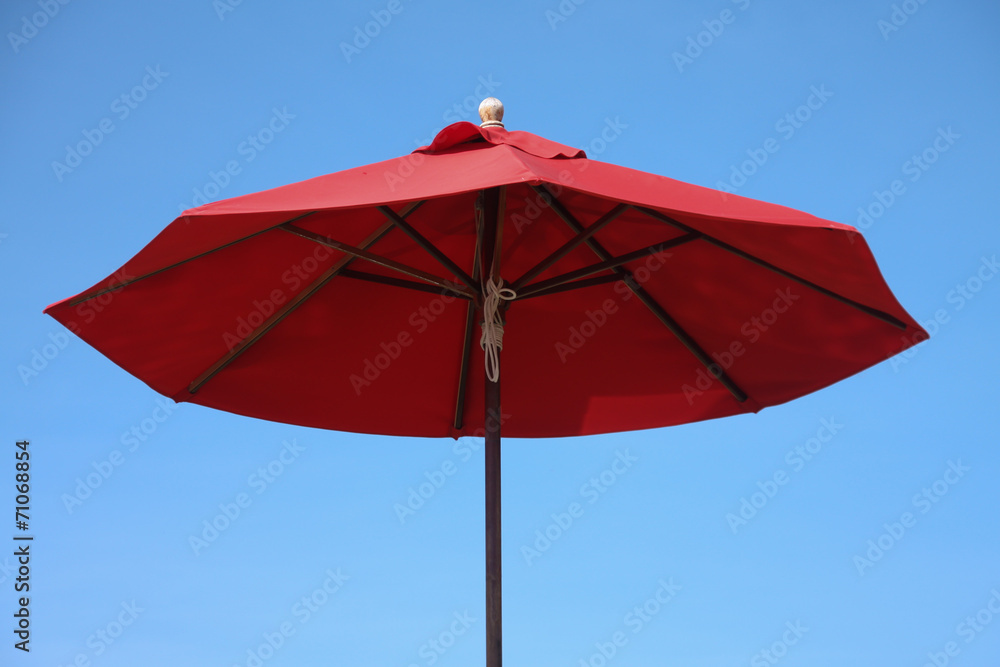 Obraz premium Beach Umbrella and blue sky