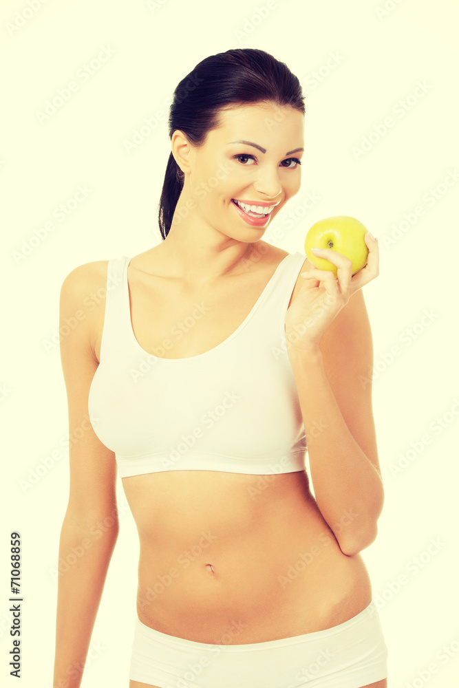 Beautiful woman with clean fresh healthy skin holding green appl Beautiful woman with clean fresh healthy skin holding green appl