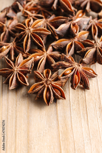 Anise seeds on wooden table,