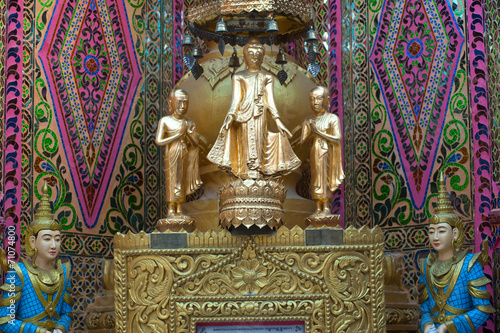 Standing Buddha at Sutaungyai Pagoda in Mandalay Hill. photo