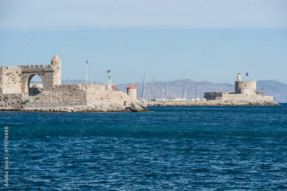 Harbour Gates and Lighthouse St. Nicholas at Rhodes, Greece.